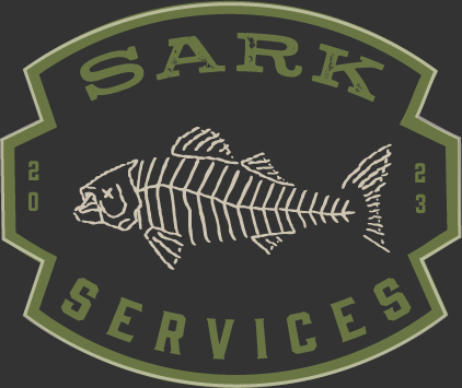Sark Services — olive-on-charcoal SARK SERVICES badge with fish-skeleton illustration.