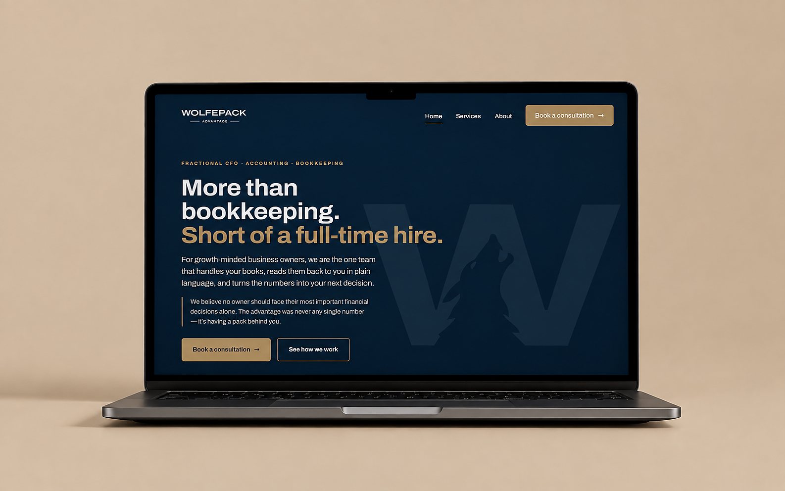 Laptop mockup showing the Wolfepack Advantage website hero — dark navy interior with the wolf-in-W mark set behind a large sans-serif headline.